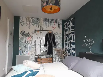 Un ou plusieurs lits dans un hébergement de l'établissement CHAMBRE DANS UN ECRIN DE VERDURE