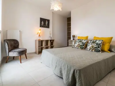 Un ou plusieurs lits dans un hébergement de l'établissement Appartement à Saint-Brevin-les-Pins avec Balcon et Parking - FR-1-306-1242
