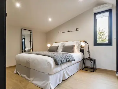 Un ou plusieurs lits dans un hébergement de l'établissement Gîte Charmant avec Piscine Chauffée près de Nantes et Clisson - FR-1-306-1245