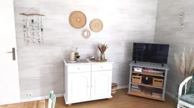 Télévision ou salle de divertissement dans l'établissement Les Becs - Appartement bord de mer, 1 chambre