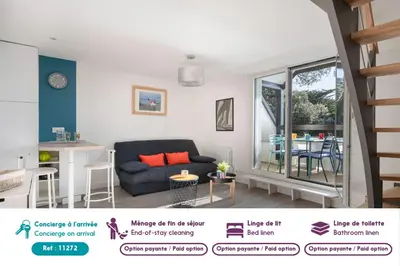 Coin salon dans l'établissement Appartement vue mer et les pieds dans l'eau!
