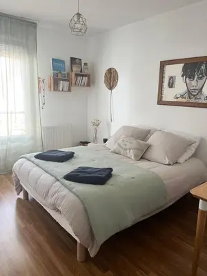 Un ou plusieurs lits dans un hébergement de l'établissement Cosy Room