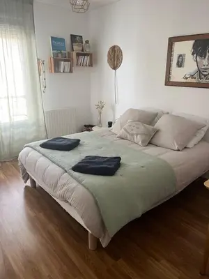 Un ou plusieurs lits dans un hébergement de l'établissement Cosy Room