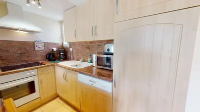 Cuisine ou kitchenette dans l'établissement Le Cottage des Fontenelles