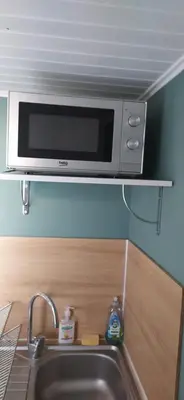 Cuisine ou kitchenette dans l'établissement Studio indépendant au calme