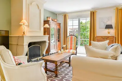 Coin salon dans l'établissement Magnolia - Charmante maison avec jardin