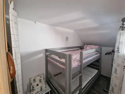 Un ou plusieurs lits dans un hébergement de l'établissement Charmant duplex à 500 m de la plage