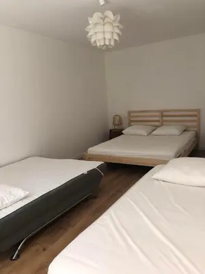 Un ou plusieurs lits dans un hébergement de l'établissement La Ferme du domaine de La Mazure