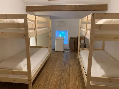 Un ou plusieurs lits dans un hébergement de l'établissement La Ferme du domaine de La Mazure