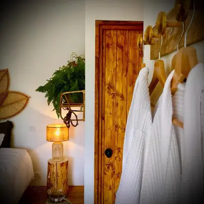 Un ou plusieurs lits dans un hébergement de l'établissement La Petite Grange - Spa Balnéo
