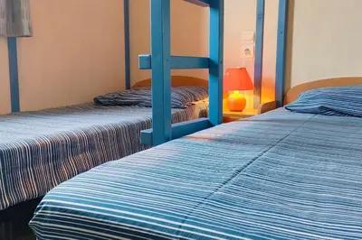 Un ou plusieurs lits dans un hébergement de l'établissement Chalet spacieux à 8 km de la mer