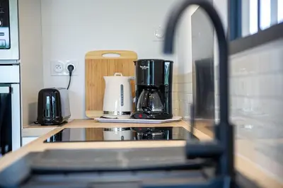 Cuisine ou kitchenette dans l'établissement Maison familiale La Belle Vie jacuzzi/sauna