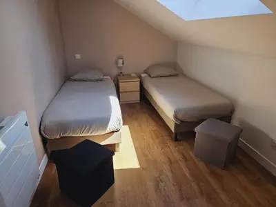 Un ou plusieurs lits dans un hébergement de l'établissement Maison de 2 chambres proche A11 Ancenis, Logis du Château Rouge
