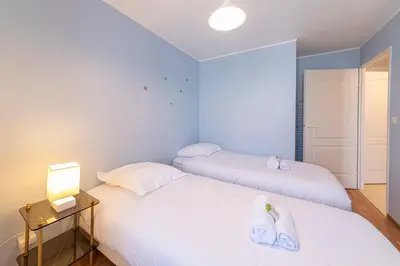 Un ou plusieurs lits dans un hébergement de l'établissement Le Galilée - Wifi - Balcon