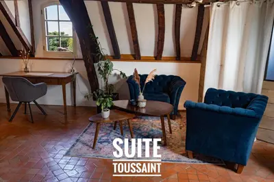 Coin salon dans l'établissement Suite Toussaint - Calme & Authentique