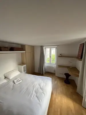 Un ou plusieurs lits dans un hébergement de l'établissement DEMAIN Hôtel