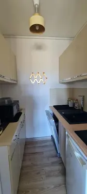 Cuisine ou kitchenette dans l'établissement Appartement à 100 m de la plage avec parking