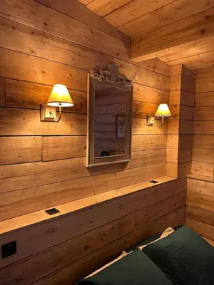 Un ou plusieurs lits dans un hébergement de l'établissement Le Chalet
