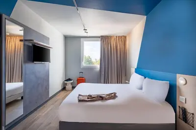 Un ou plusieurs lits dans un hébergement de l'établissement ibis budget Nantes Nord Treillières