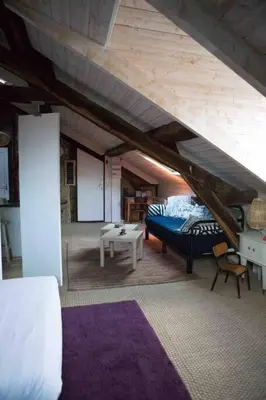 Un ou plusieurs lits dans un hébergement de l'établissement Loft charmant dans le centre historique