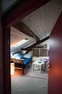 Un ou plusieurs lits dans un hébergement de l'établissement Loft charmant dans le centre historique