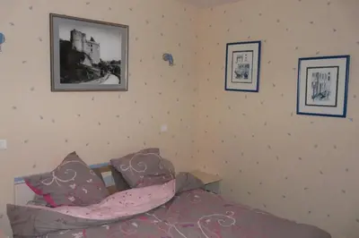 Un ou plusieurs lits dans un hébergement de l'établissement Gîte Léperon 2