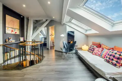 Coin salon dans l'établissement Duplex de 115m2 dans un bâtiment chic historique - Le Belvédère St Nicolas