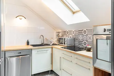 Cuisine ou kitchenette dans l'établissement L'Ingénieux - Appt près de la Place Zola