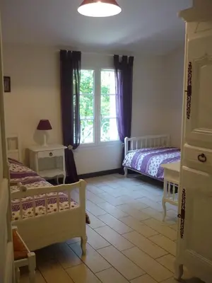 Un ou plusieurs lits dans un hébergement de l'établissement La maison au bord du lac