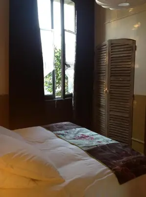 Un ou plusieurs lits dans un hébergement de l'établissement Il Était Une Fois Chez Moi