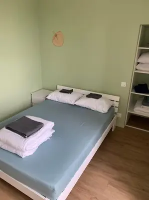 Un ou plusieurs lits dans un hébergement de l'établissement Appartement Sakura - Maulévrier Cholet Puy du Fou