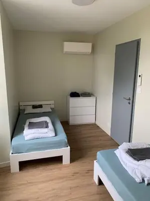 Un ou plusieurs lits dans un hébergement de l'établissement Appartement Sakura - Maulévrier Cholet Puy du Fou