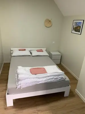 Un ou plusieurs lits dans un hébergement de l'établissement Appartement Ikebana - Maulévrier Cholet Puy du Fou