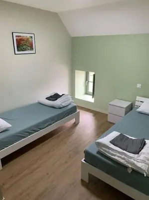 Un ou plusieurs lits dans un hébergement de l'établissement Appartement Ikebana - Maulévrier Cholet Puy du Fou