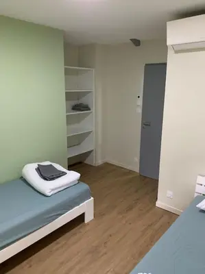 Un ou plusieurs lits dans un hébergement de l'établissement Appartement Ikebana - Maulévrier Cholet Puy du Fou