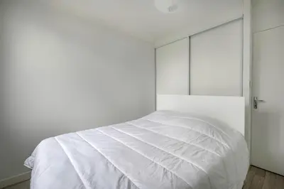 Un ou plusieurs lits dans un hébergement de l'établissement Maison avec jardin à 500m de la plage Pornic