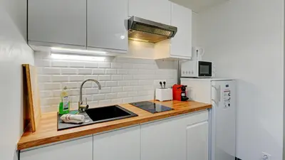 Cuisine ou kitchenette dans l'établissement Le Rozé - Appart'Escale