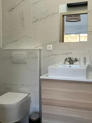 Salle de bains dans l'établissement L’Oasis