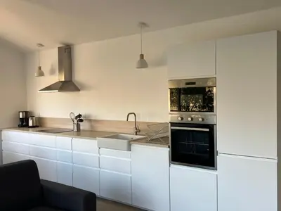 Cuisine ou kitchenette dans l'établissement L’Oasis
