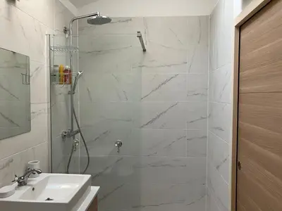 Salle de bains dans l'établissement L’Oasis