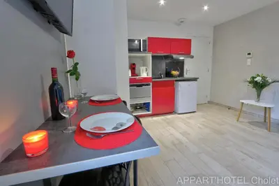 Cuisine ou kitchenette dans l'établissement Appart hotel Cholet Carteron