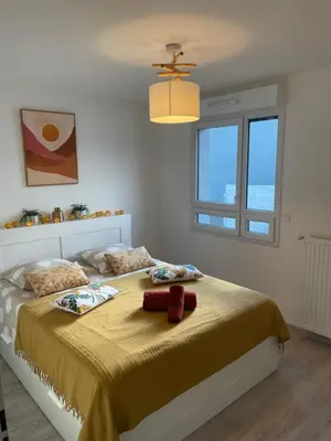 Un ou plusieurs lits dans un hébergement de l'établissement Villa des Cerisiers