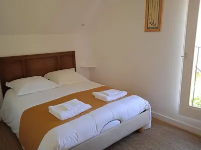 Un ou plusieurs lits dans un hébergement de l'établissement Cottage spacieux Domaine de la Bretesche