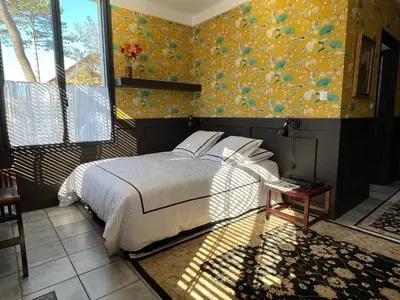 Un ou plusieurs lits dans un hébergement de l'établissement Un studio dans une villa balnéaire