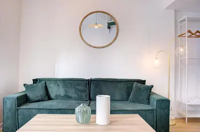 Coin salon dans l'établissement Le Harmony - Appart'Escale