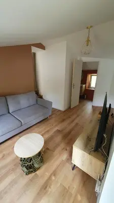 Coin salon dans l'établissement Appartement au calme