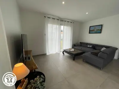 Coin salon dans l'établissement Maison neuve en Vendée, 3 chambres, proche véloroute et océan, wifi, terrasses, tout inclus. - FR-1-426-542
