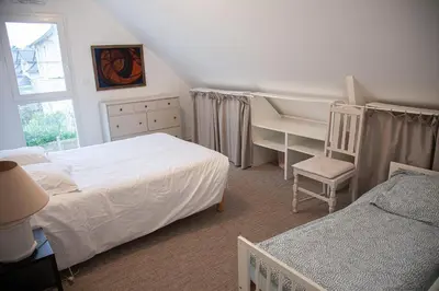 Un ou plusieurs lits dans un hébergement de l'établissement Maison de vacances bord de mer