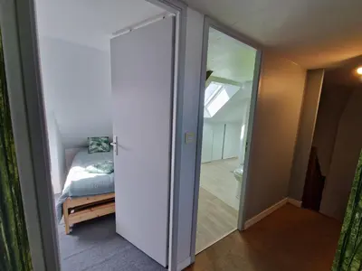 Un ou plusieurs lits dans un hébergement de l'établissement Maison 6 chambres Saint Nazaire 5 min de la mer