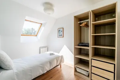 Un ou plusieurs lits dans un hébergement de l'établissement Le coin des Songes - Maison avec jardin